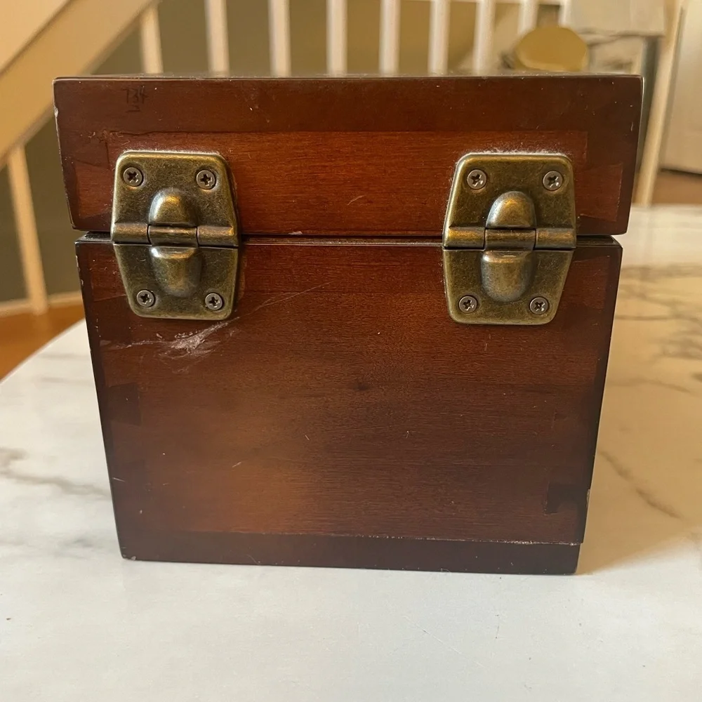 Wooden box for displaying coins with the name marked Danze logo